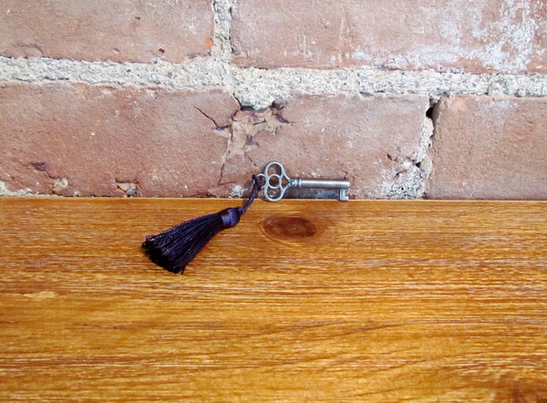 Antique Skeleton Cabinet Door Key And Purple Tassel